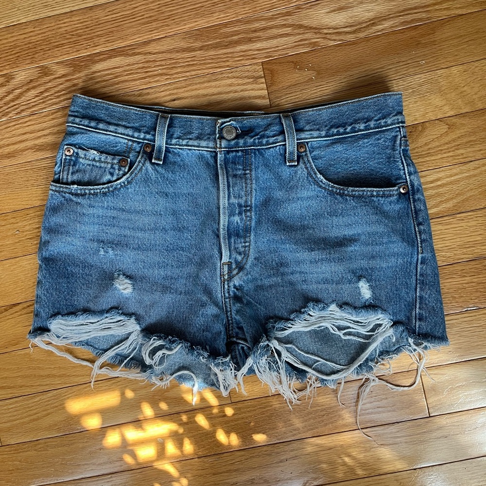 Levi’s 501 Medium Wash distressed jean shorts